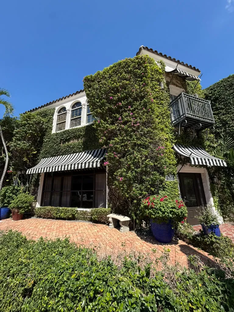 La Jolla’s ivy-covered corner, arched windows and striped awnings.